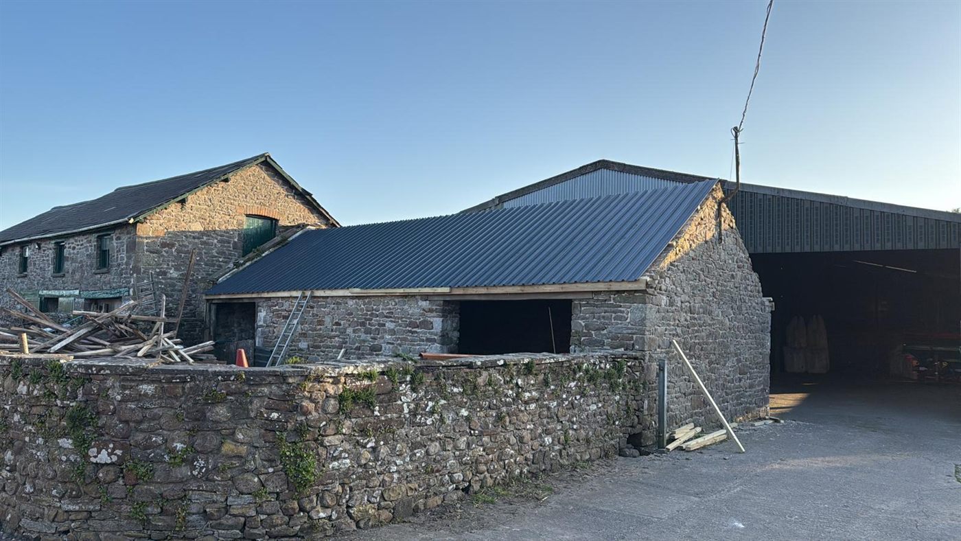 The same farm building after ESW re-roofed it, job 3