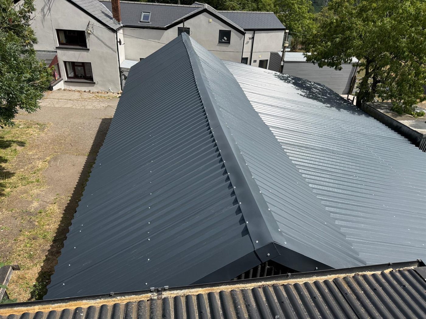 The same farm building after ESW re-roofed it, job 4