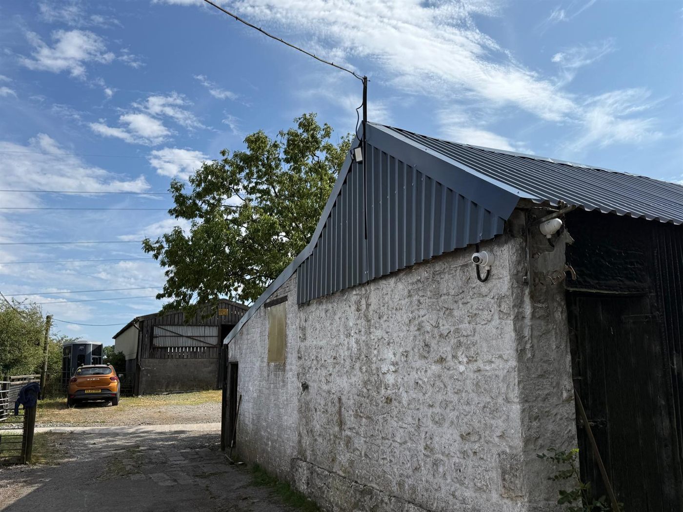 The same farm building after ESW re-roofed it, job 5