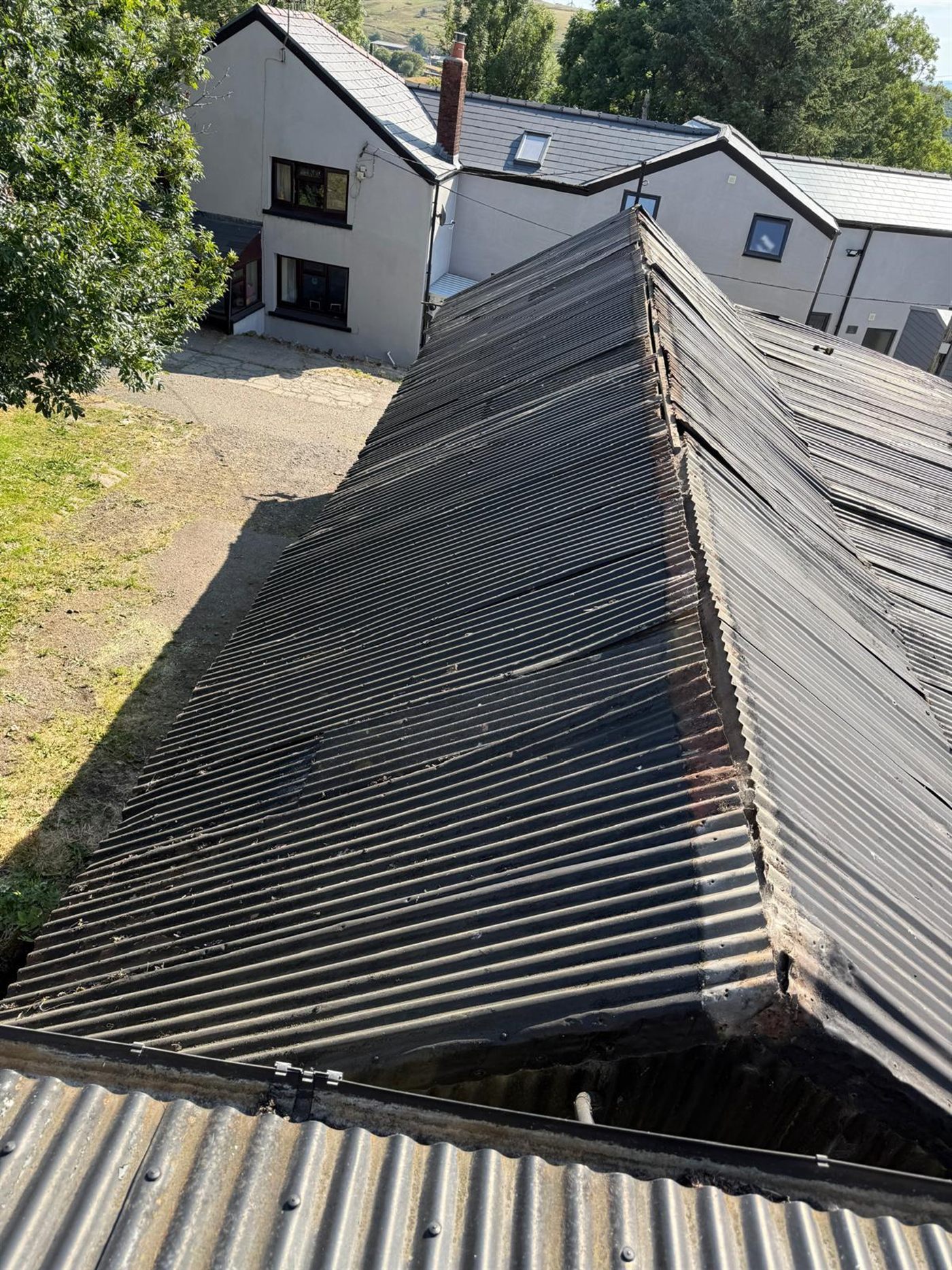 Farm building before ESW re-roofed it, job 4