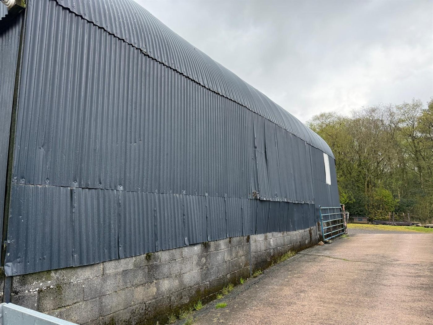 Farm building before ESW re-roofed it, job 6
