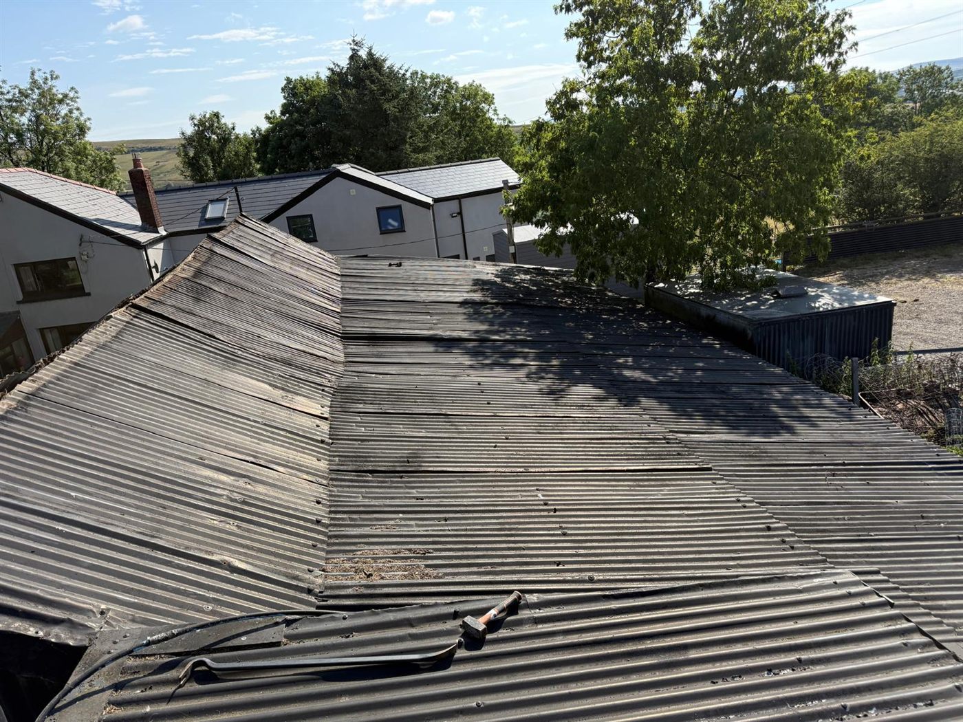 Farm building before ESW re-roofed it, job 7